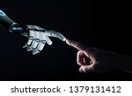 Robot hand making contact with...
