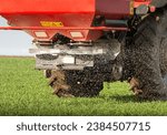  tractor fertilizing in wheat...