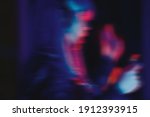 Blurred dancing dj girl background for rave party wallpaper. Blurry silhouette of disc jockey playing techno music in nightclub. Curated shutterstock collection of royalty free partying people images