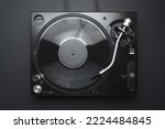 Small photo of Dj turntable in flay lay. Vinyl record player shot directly from above on black background