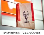 Small photo of Minsk, Belarus. Jun 2022. KFC Paper bag. Kentucky Fried Chicken (KFC) paper bag, takeout from restaurant chain. Take away food from KFC restaurant