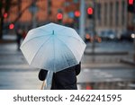 Woman with white umbrella...