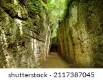 Small photo of Etruscan Le Vie Cave (Via Cava), the path connecting ancient necropolis and several settlements in the area between Sovana, Sorano and Pitigliano. Citta del Tufo archaeological park. Tuscany, Italy.