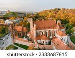 Small photo of Aerial view of St. Anne Church and neighbouring Bernardine Church, one of the most beautiful and probably the most famous buildings in Vilnius. Beautiful autumn day in the capital of Lithuania.