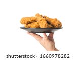 Hand Holding A Plate Of Fried...