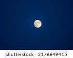 Small photo of Magical view of a nighttime sky with large full moon. Attractive astronomy phenomenon. Halloween design background concept. Exotic photo wallpaper