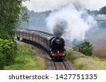Small photo of Wyre Piddle, Worcestershire, England on June 15 2019. Flying Scotsman Steam train travelling between Worcester and London Paddington