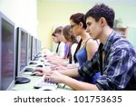 group of teens in internet-cafe with computers