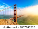Golden Gate Bridge surrounded by Fog in San Francisco at sunset, California, USA