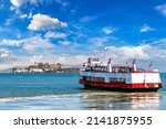 Ferry ship against Alcatraz prison Island in San Francisco, California, USA