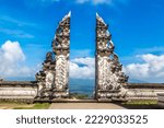 Ancient gate at Pura Penataran Agung Lempuyang temple and volcano Agung on Bali, Indonesia in a sunny day