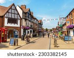 Small photo of STRATFORD-UPON-AVON, UK - JUNE 11, 2022: Typical street and old buildings in Stratford upon Avon in a summer day, UK