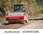 Small photo of CHIANG RAI, THAILAND - FEBRUARY 01, 2018: Outdoor view of compaction machinery for rail road construction in Chiang Mai, Thailand, working on a road construction site to smooth the ground