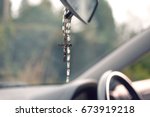 Rosary beads hanging in car
