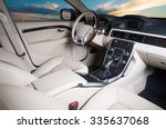 Modern car interior with sunset in the windows