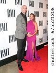 Small photo of NASHVILLE, TN-NOV 3: Recording artist Jana Kramer (R) and husband Mike Caussin attend the 63rd annual BMI Country awards on November 3, 2015 in Nashville, Tennessee.