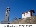 Small photo of ST-JEAN DE LUZ, FRANCE, September 23, 2023 : Lighthouse and sea walls that protect the town from the savagery of the Atlantic Ocean. City has become a famous touristic resort.