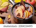 Hot mulled wine with fruits and spices. Autumn cocktail