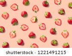 Colorful pattern of strawberries on pink background. Top view