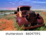 A Rusty Old Pick Up Truck Sits...