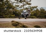 Small photo of Sierra de los Filabres, Spain - May 5th 2021: Motorbike rider riding BMW R 1250 GS motorcycle in a mountain road across beautiful turns, during Dunlop Xperience event in Sierra de los Filabres, Spain.
