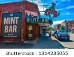 Small photo of Sheridan, WY / USA - 09-01-2014: Wyoming's legendary meeting place, the Mint Bar is Sheridan's oldest bar and the best place to order a ditch, straight up whiskey and water.