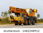 Small photo of Novyy Urengoy, Russia - July 30, 2019: Industrial mobile crane Demag AC 155 at the interurban road.