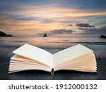 Digital composite image of Stunning sunrise landsdcape of idyllic Broadhaven Bay beach on Pembrokeshire Coast in Wales in pages of open book