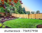 View of an attractive backyard with new planting beds and well kept lawn. Northwest, USA