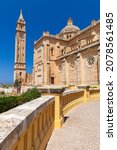 Small photo of The Basilica of the National Shrine of the Blessed Virgin of Ta Pinu on a sunny day. It is a Roman Catholic minor basilica and national shrine located on the island of Gozo, Malta