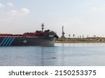 Small photo of Ismailia, Egypt - November 1, 2021: Coronet tanker ship goes the Suez Canal on a sunny day