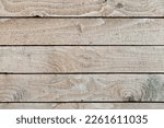 Small photo of Old uncolored wooden wall made of rough boards, close up photo, front view, background texture