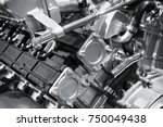 V12 car engine fragment, closeup photo with selective focus