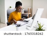 African American Business Accountant In Office Doing Accounting Work