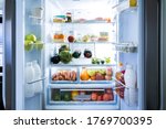 Open Refrigerator Or Fridge Door With Food Inside