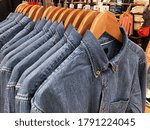 jeans jacket.with blue jeans on the hanger .sweater for sale in the shop


 