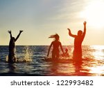 Silhouettes Of Young Group Of...
