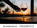 Female Hand Reaching A Glass Of ...