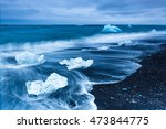 Glacier icebergs form abstract shapes in the ocean at Black diamond beach, Jokulsarlon, Iceland