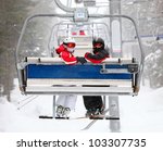 Skiers on a ski-lift