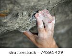 Rock Climber's Hand Grasping...