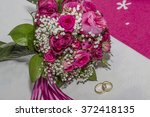 Small photo of Inalienable utensil for the newlyweds - the bridal bouquet and wedding rings