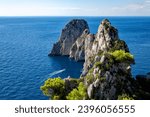Small photo of Rock formations Faraglioni, Island Capri, Gulf of Naples, Italy, Europe. Rock formations Faraglione di terra Stella, Faraglione di mezzo, Faraglione di fuori Scopolo.