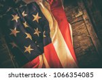 American Flag on the Reclaimed Wood Crate Closeup Photo. United States of America Country Vintage Theme.