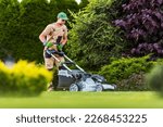 Professional gardener mowing...