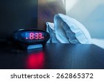 Hotel Room Alarm Clock. Waking Up in a Hotel Photo Concept. Business Travels.