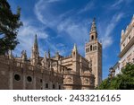 Small photo of Seville Cathedral and Giralda bell tower in city of Seville, Andalusia, Spain.