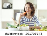 Young Woman Eating Carrot.