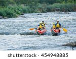 Small photo of Yappy family of four river rafting on the catamaran