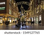 Small photo of BREMEN, GERMANY - DECEMBER 4, 2018: Swineherd and his herd monument at Sogestrasse street with Christmas illumination in night. The bronze monument by sculptor Peter Lehmann was unveiled in 1974.